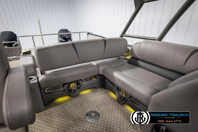 Slide: The Image of 2022 Avalon Catalina VRB boat interior with gray seating and ambient lighting. - 25