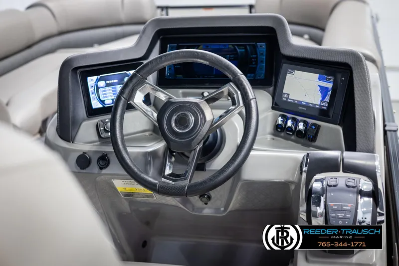 Slide: The Image of 2022 Avalon Catalina VRB boat dashboard with steering wheel and digital displays. - 27