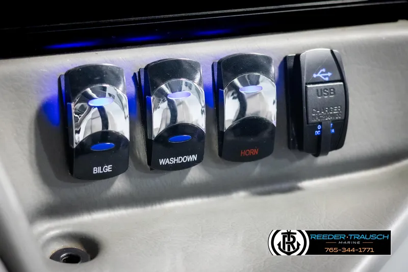 Slide: The Image of Control panel of 2022 Avalon Catalina VRB with bilge, washdown, horn, and USB charger switches. - 35