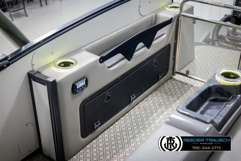 Slide: The Image of 2022 Avalon Catalina VRB boat interior with cup holders and storage compartments. - 40