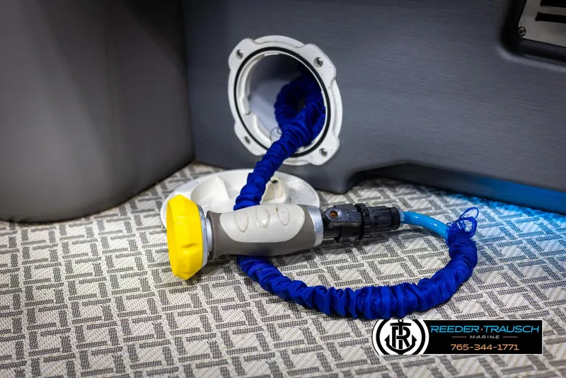 Slide: The Image of 2022 Avalon Catalina VRB boat interior with coiled blue hose and nozzle. - 46