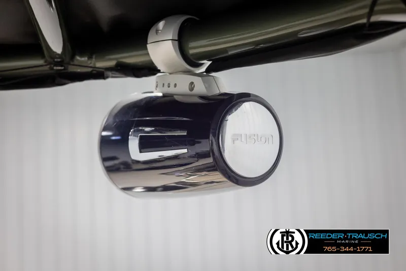 Slide: The Image of 2022 Avalon Catalina VRB boat speaker with Fusion branding, mounted under a canopy. - 48