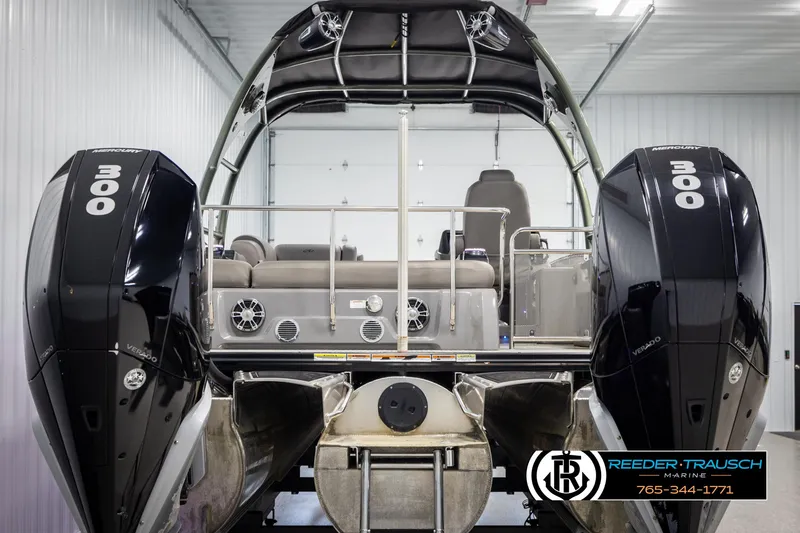 Slide: The Image of 2022 Avalon Catalina VRB pontoon boat with dual 300 horsepower engines in a showroom. - 6