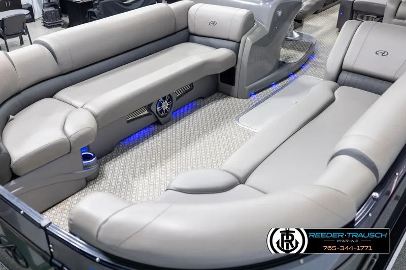Slide: The Image of 2022 Avalon Catalina VRB boat interior with plush seating and ambient blue lighting. - 9