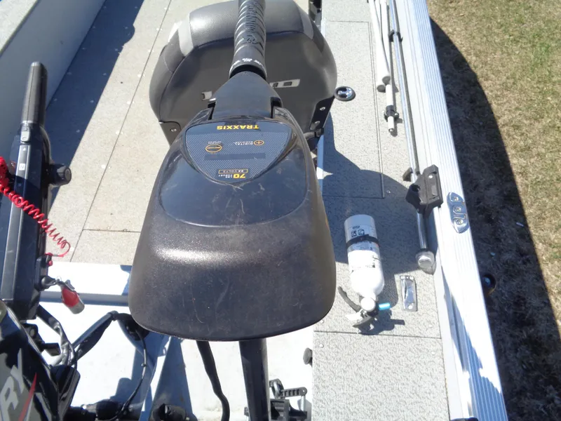 Slide: The Image of 2023 Lund 1600 Alaskan Tiller boat interior with motor and equipment. - 9