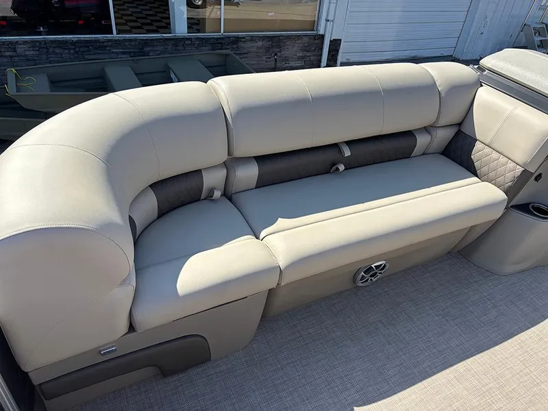 Slide: The Image of 2025 Sun Tracker Party Barge 20 DLX, featuring luxurious beige seating. - 13