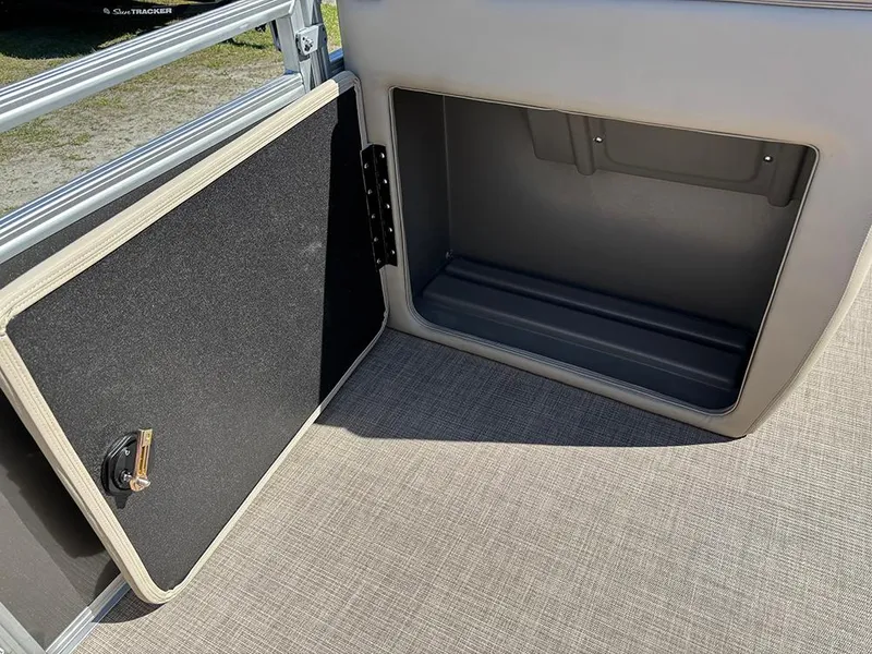 Slide: The Image of Open storage compartment on 2025 Sun Tracker Party Barge 20 DLX pontoon boat. - 16