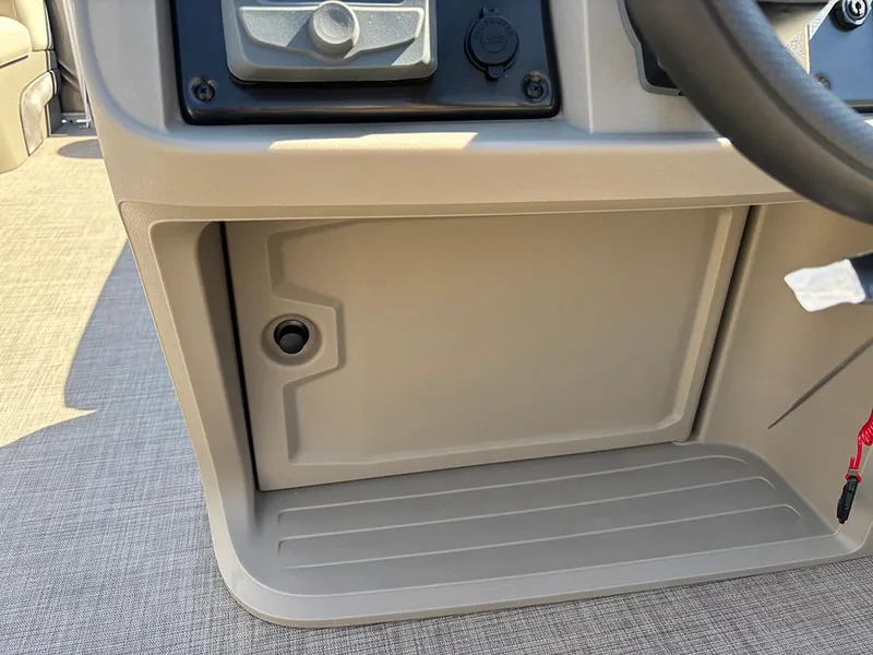 Slide: The Image of 2025 Sun Tracker Party Barge 20 DLX dashboard storage compartment. - 25