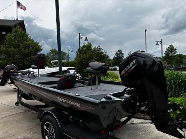 Slide: The Image of 2025 Ranger RT178 boat with Mercury engine on trailer, parked outdoors. - 1