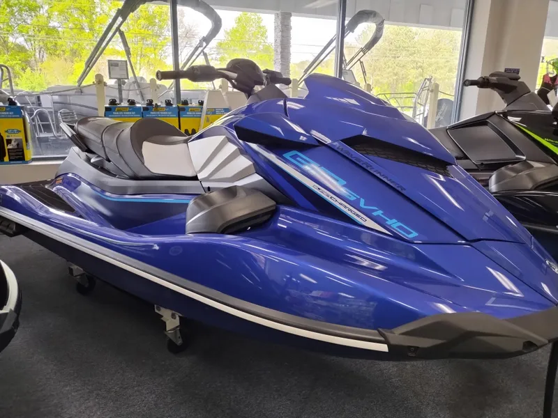 Slide: The Image of 2024 Yamaha WaveRunner GP SVHO in showroom, sleek blue design, high-performance watercraft. - 0