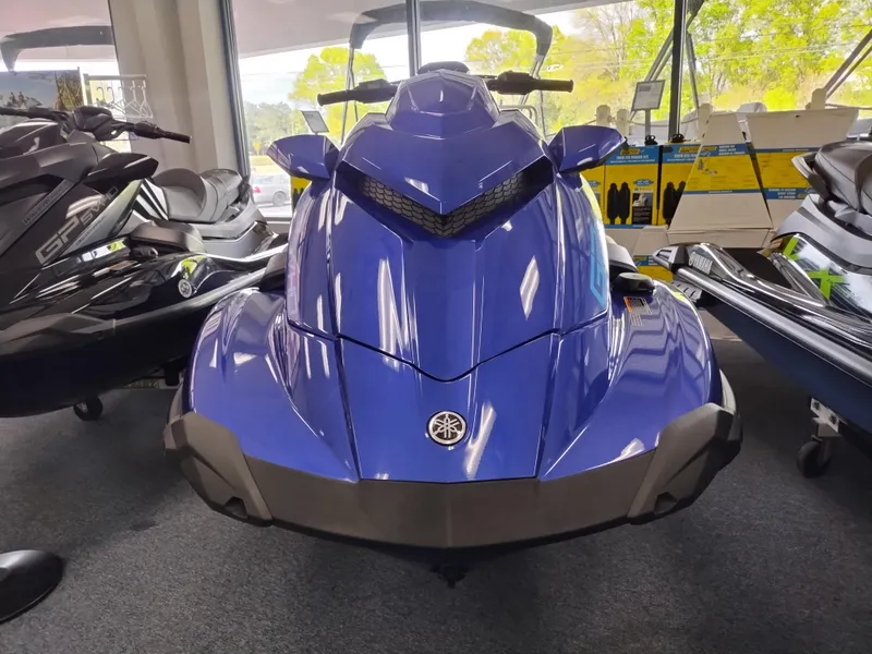 Slide: The Image of 2024 Yamaha WaveRunner GP SVHO in showroom, sleek blue design, front view. - 2