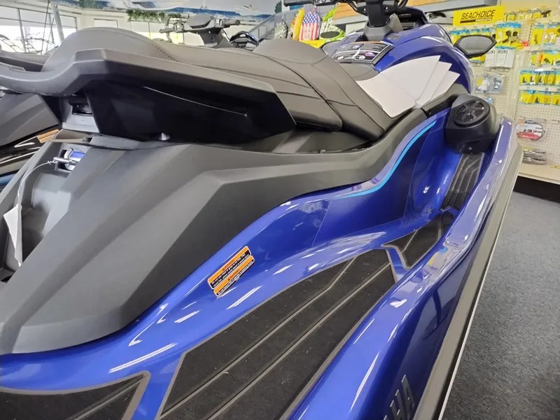 Slide: The Image of 2024 Yamaha WaveRunner GP SVHO in showroom, sleek blue design, side view. - 4