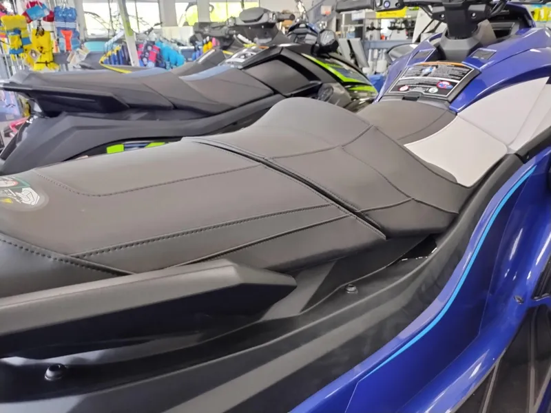 Slide: The Image of 2024 Yamaha WaveRunner GP SVHO jet ski, blue and black, displayed in showroom. - 5