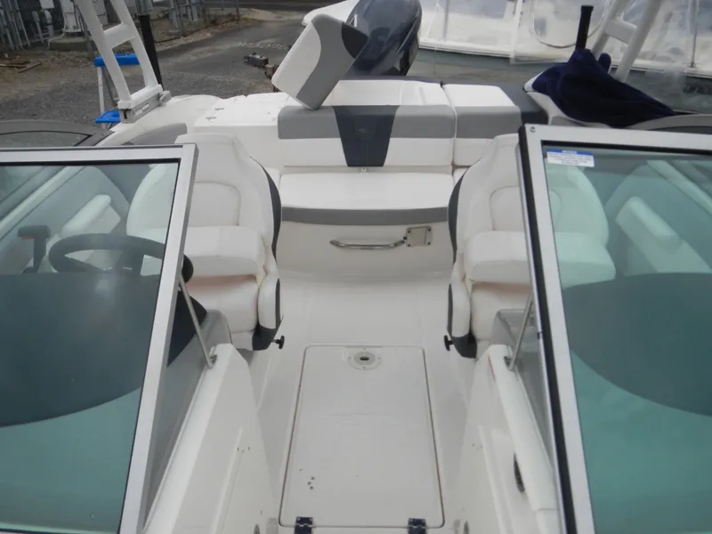 Slide: The Image of 2021 Chaparral 21 SSi OB boat interior with seating and steering wheel. - 13