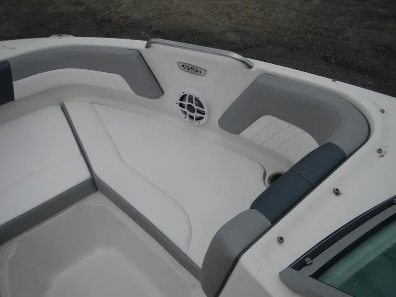 Slide: The Image of 2021 Chaparral 21 SSi OB boat interior with cushioned seating and speaker. - 17