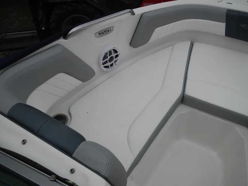 Slide: The Image of 2021 Chaparral 21 SSi OB boat interior with cushioned seating and speaker. - 18