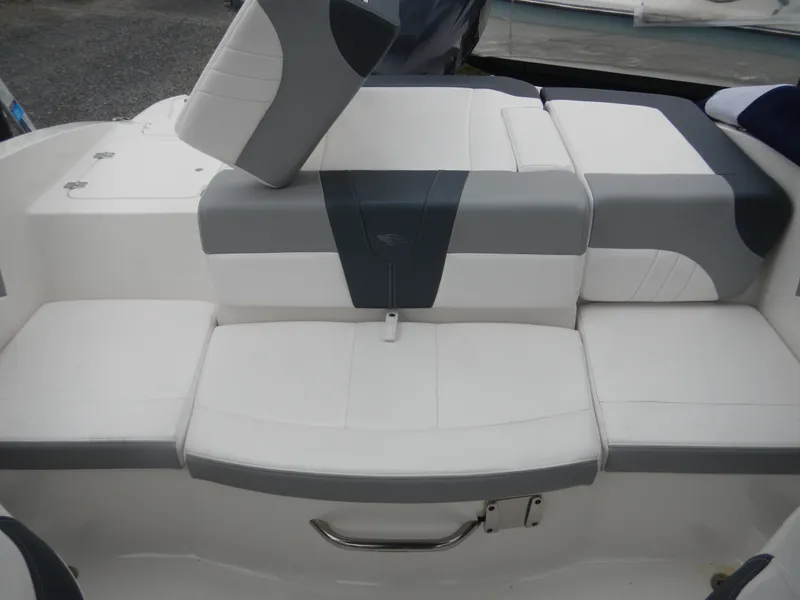 Slide: The Image of 2021 Chaparral 21 SSi OB boat interior with gray and white seating. - 23