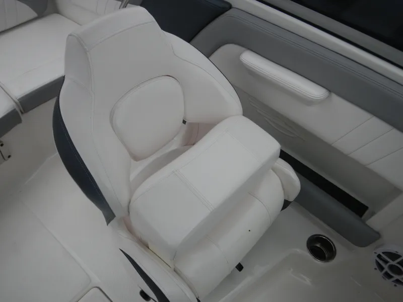 Slide: The Image of 2021 Chaparral 21 SSi OB boat interior with white cushioned seating. - 26