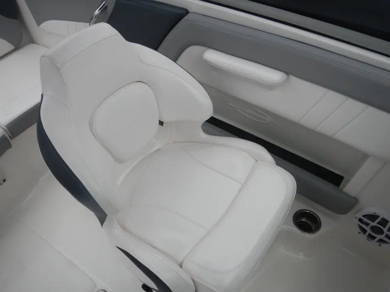 Slide: The Image of 2021 Chaparral 21 SSi OB boat interior with white cushioned seating. - 27