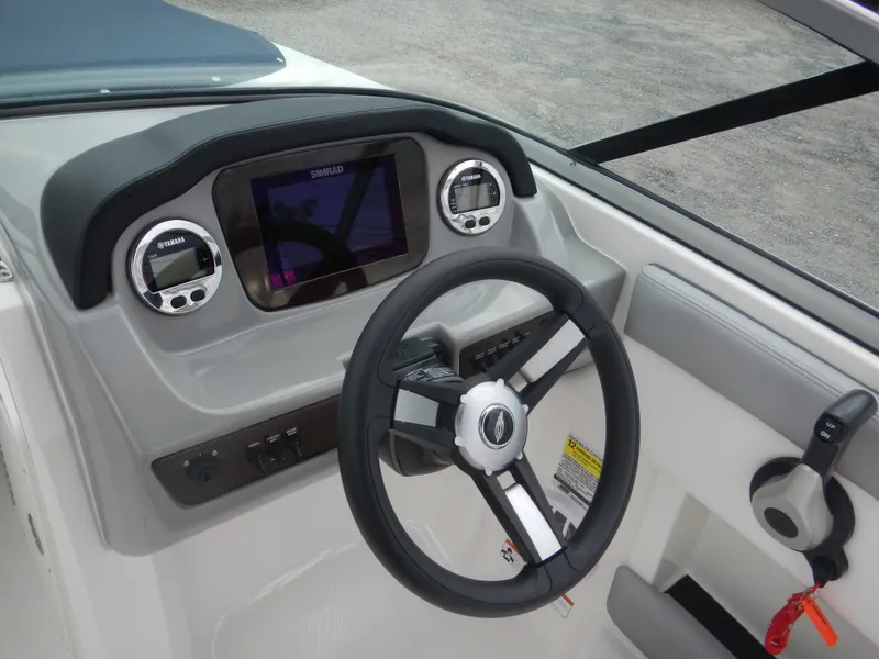 Slide: The Image of 2021 Chaparral 21 SSi OB boat dashboard with steering wheel and digital display. - 29