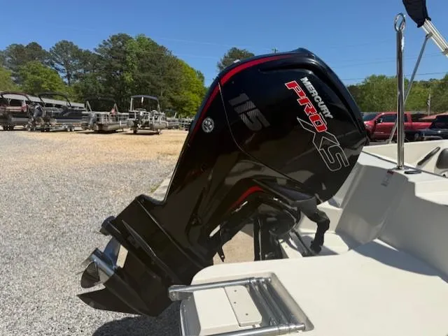 Slide: The Image of 2018 Stingray 182 SC boat with Mercury Pro XS outboard motor in a sunny outdoor setting. - 1