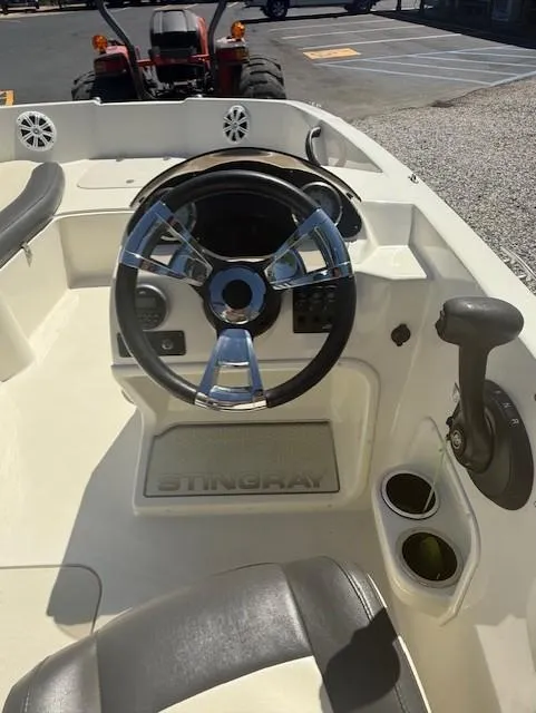 Slide: The Image of 2018 Stingray 182 SC boat interior with steering wheel and controls. - 4