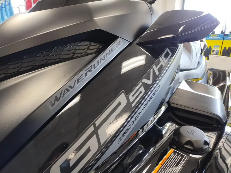 Slide: The Image of 2024 Yamaha WaveRunner GP SVHO, sleek black design, close-up view of branding. - 12