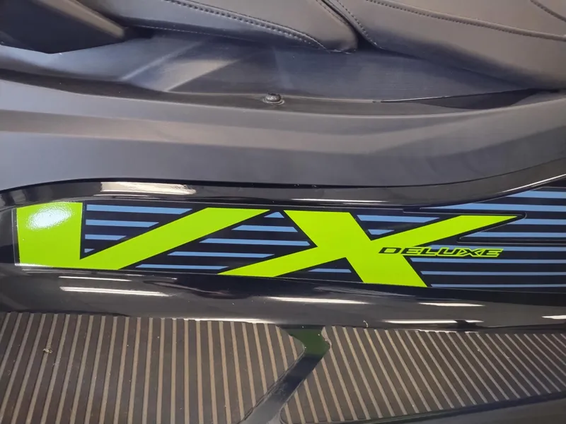 Slide: The Image of 2024 Yamaha WaveRunner VX Deluxe, sleek design with vibrant green accents. - 3