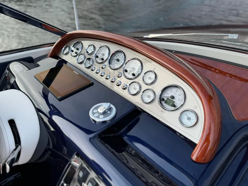Slide: The Image of Dashboard of a 2015 Riva Aquariva Super boat with classic gauges and controls. - 15