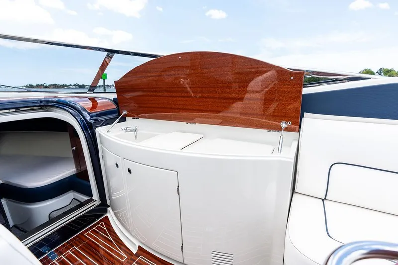 Slide: The Image of 2015 Riva Aquariva Super yacht interior with sleek wood and white cabinetry. - 27