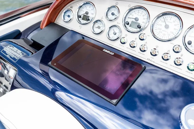 Slide: The Image of Dashboard of 2015 Riva Aquariva Super with gauges and Simrad display. - 34