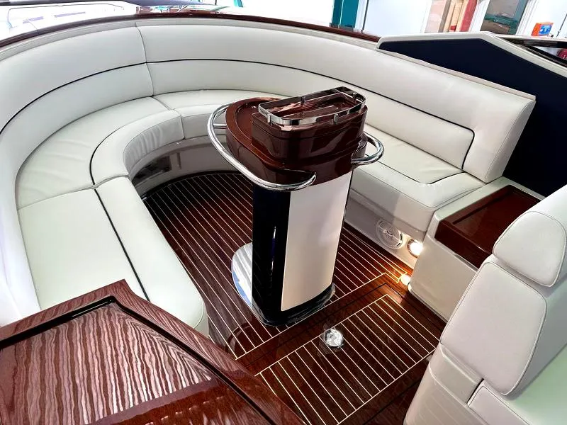 Slide: The Image of Luxurious interior of a 2015 Riva Aquariva Super yacht with elegant seating and wood finishes. - 4