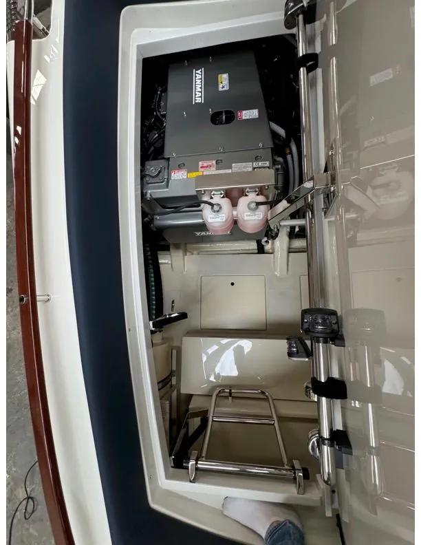 Slide: The Image of 2015 Riva Aquariva Super engine compartment with visible components and ladder. - 5