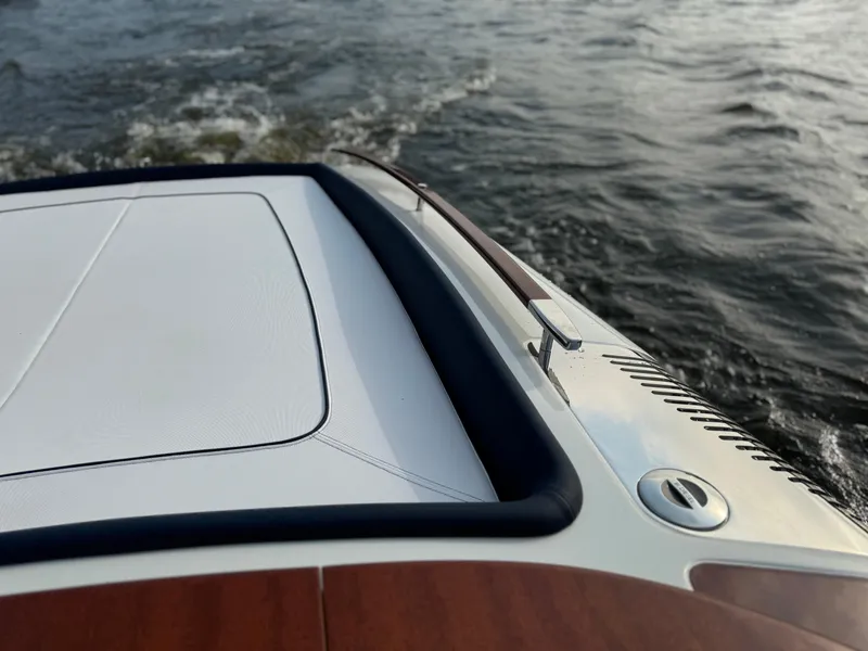 Slide: The Image of 2015 Riva Aquariva Super boat cruising on water, showcasing sleek design and craftsmanship. - 9