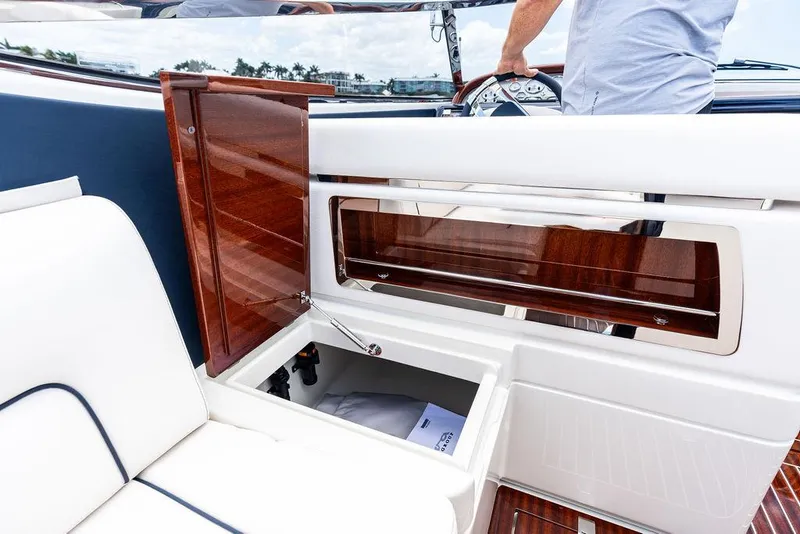 Slide: The Image of 2015 Riva Aquariva Super interior with open storage compartment and luxurious wood finish. - 28