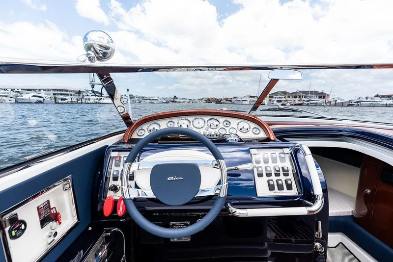 Slide: The Image of Cockpit of 2015 Riva Aquariva Super yacht with steering wheel and control panel. - 30