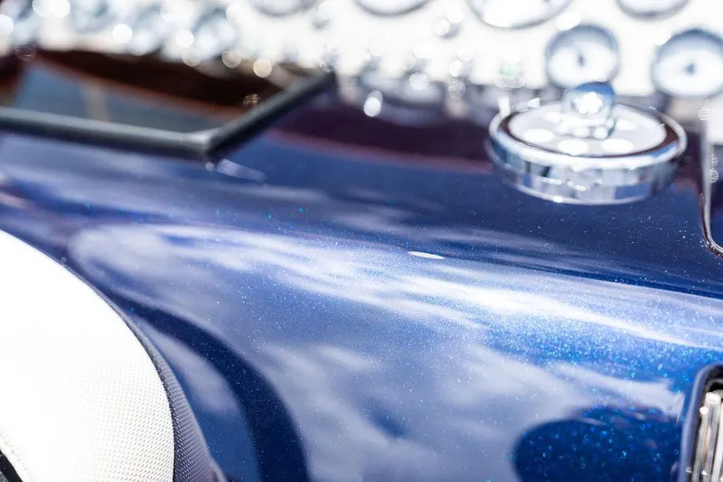 Slide: The Image of Close-up of a 2015 Riva Aquariva Super dashboard with glossy blue finish. - 36