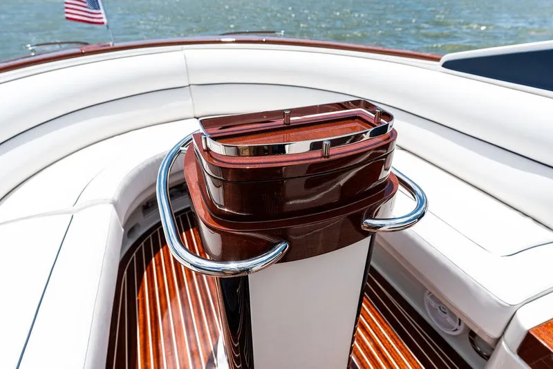 Slide: The Image of 2015 Riva Aquariva Super boat interior with polished wood and white seating. - 44