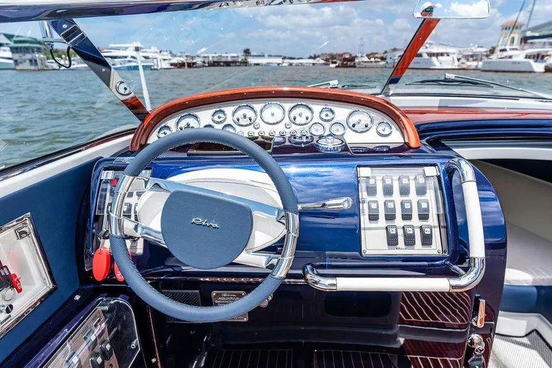 Slide: The Image of Cockpit of 2015 Riva Aquariva Super yacht with elegant dashboard and steering wheel. - 46