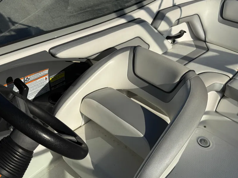 Slide: The Image of 2017 Yamaha Boats AR190 interior with white and gray seating and steering wheel. - 12