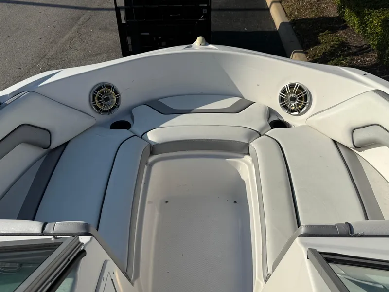 Slide: The Image of 2017 Yamaha Boats AR190 bow seating area with speakers and cushioned seats. - 14