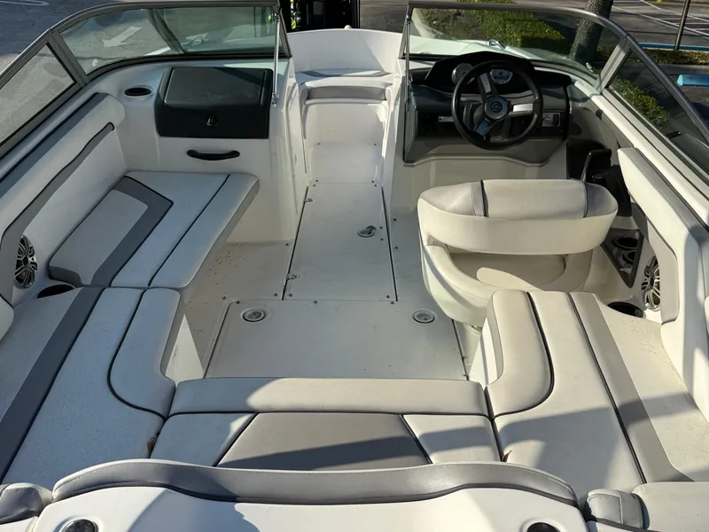 Slide: The Image of 2017 Yamaha Boats AR190 interior with white seating and steering wheel. - 15