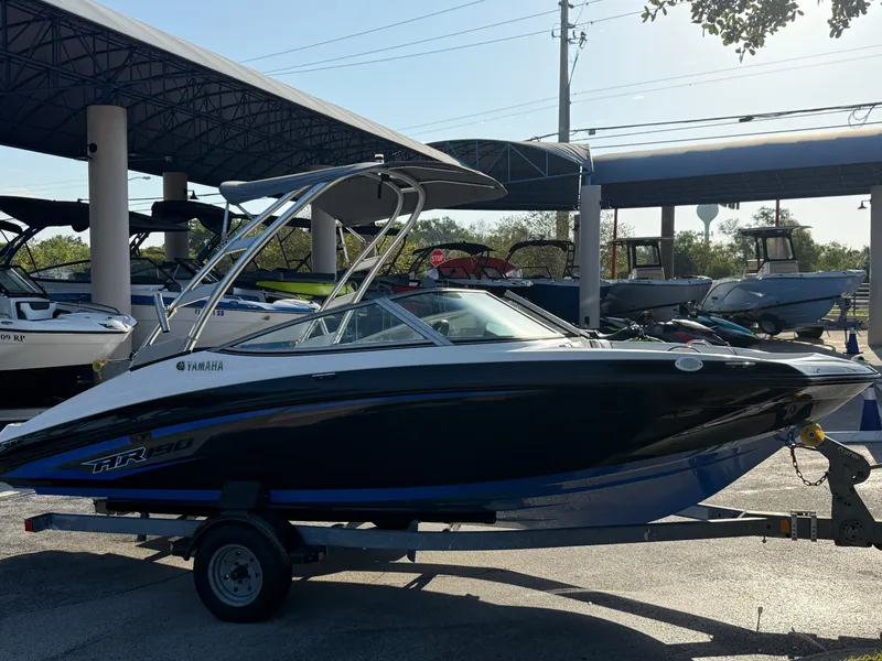 Slide: The Image of 2017 Yamaha AR190 boat on trailer at dealership, side view. - 2