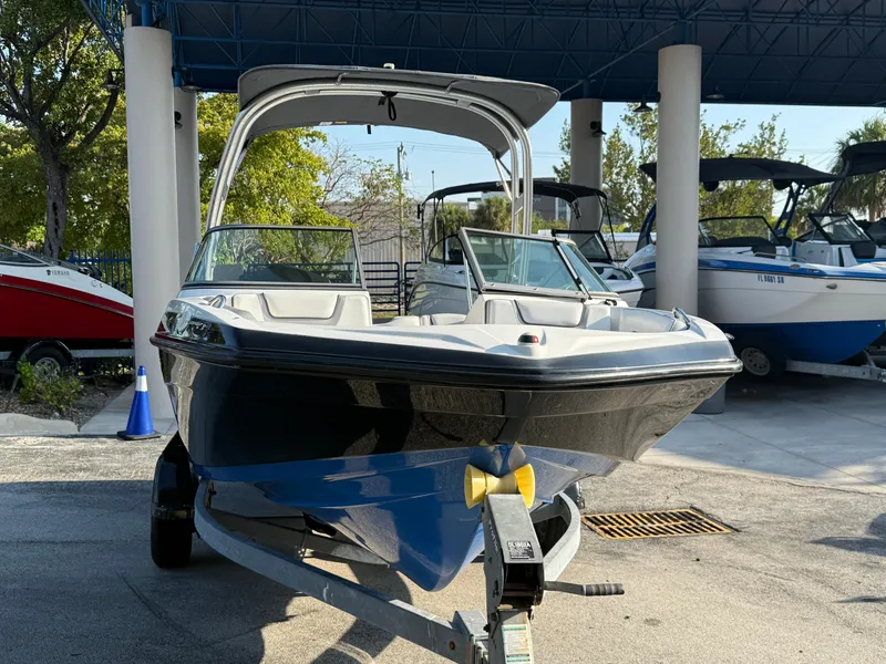 Slide: The Image of 2017 Yamaha Boats AR190 on trailer, parked outdoors under a blue canopy. - 8