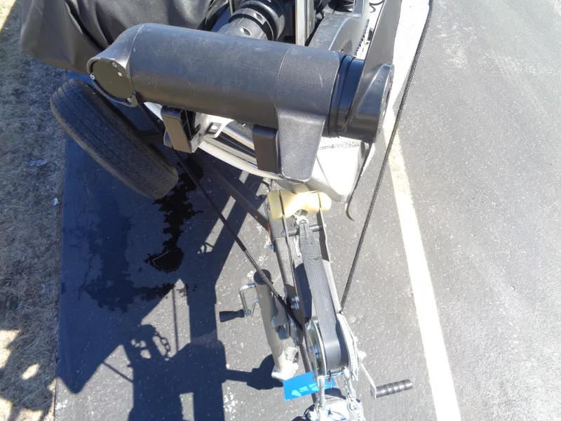Slide: The Image of 2023 Lund 1600 Alaskan Tiller boat trailer hitch and winch on pavement. - 16