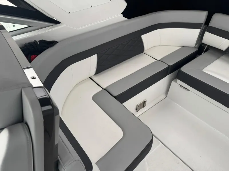 Slide: The Image of 2020 Monterey 295 Sport Yacht interior with sleek, modern seating design. - 13