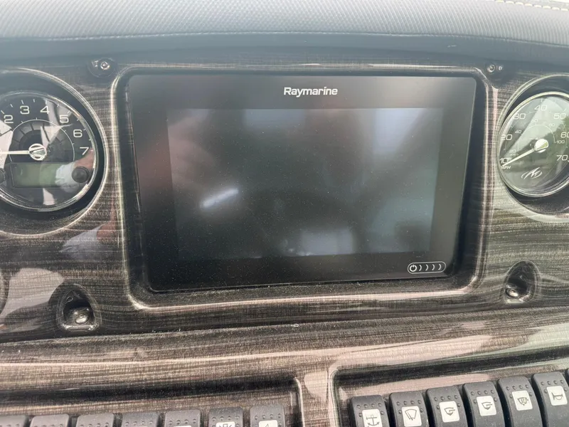 Slide: The Image of Dashboard of 2020 Monterey 295 Sport Yacht with Raymarine display and gauges. - 21