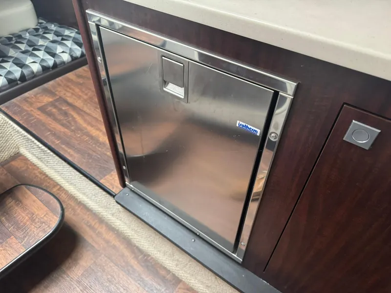Slide: The Image of Stainless steel refrigerator in 2020 Monterey 295 Sport Yacht interior. - 27