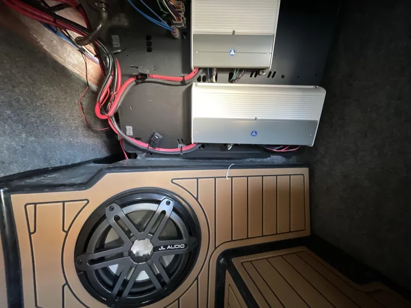 Slide: The Image of 2017 Nautique Super Air G23 audio system with JL Audio subwoofer and amplifiers. - 25