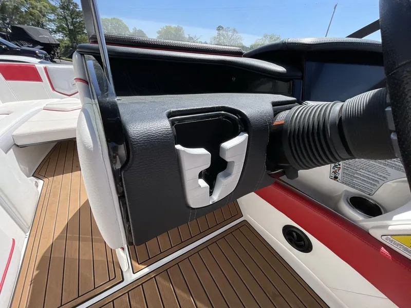 Slide: The Image of 2017 Nautique Super Air G23 steering wheel and dashboard, featuring sleek design and wood flooring. - 31